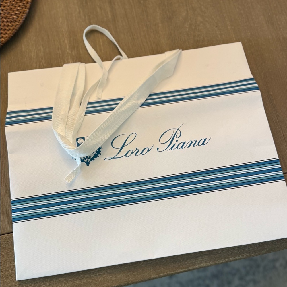 Loro Piana White Bag with Blue Stripes paper bag.